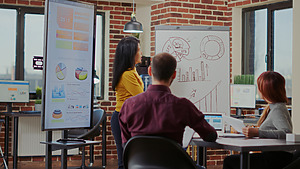 diverse team of colleagues listening to business p 2023 11 27 05 19 11 utc