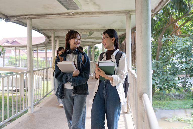 two college student female friends smile ready for 2023 11 27 05 20 26 utc